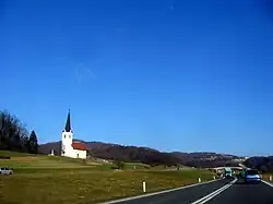 St. Peter's Church next to the local road in Jezero