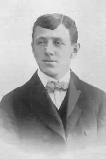 Black & white studio portrait of a man