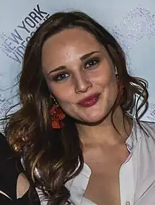 A 35-year-old woman with brown hair smiling at the camera.