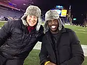 Sportscaster Joe Amorosino and Devin McCourty of the New England Patriots posing together outside for a picture at Gillette Stadium in Foxboro, Massachusetts.