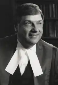 Black and white portrait of Kryczka in judicial robe with white collar