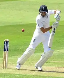 Joe Root playing a shot