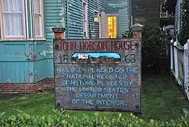 Sign in front of house