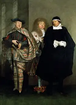 Three men looking at each other. One is dressed in tartan, one is wearing a large wig and bows on his shoes, and one is wearing black and white.