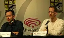 A picture of Jonas Rivera and Pete Docter speaking to an audience.