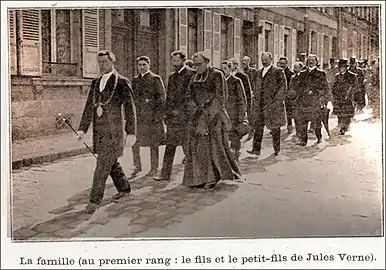 Verne's funeral procession, headed by his son and grandson