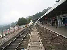 Station photographed from between two tracks