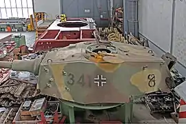 Tiger II tank equipped with the Nahverteidigungswaffe on the right side of the roof.