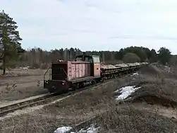 Locomotive TU7-1703 with freight train