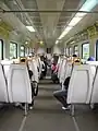 The (modified—with walls cut open and additional handle bars) interior of a Class 81 EMU train.