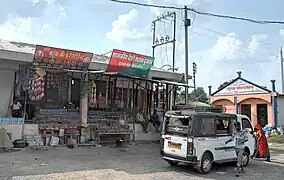 Government liquor shop outside the temple