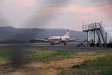 An airplane sits at a runway.