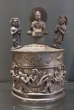 The "Kanishka casket," with the Buddha surrounded by Brahma and Indra, and Kanishka on the lower part, 127 CE.