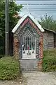 The Chapel of the Holy Family with a slab mentioning the Hoeve Laer Farm. Built in 1869.