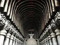 Timber ribs on the roof at the Karla Caves; the umbrella over the stupa is also wood