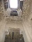 View from the lower levels up to the skylight that opens in the middle of the upper-floor patio, inside the main kasbah residence