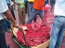 Image 45Pagara (red firecracker ribbons) (from Suriname)