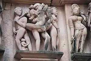 Mithuna or erotic scene from the temple of Khajurāho.