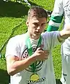 Photo of Kieran Tierney with league championship medal in May 2016