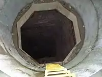 Kites Shaft (disused), a typical old Cornish mine shaft; it has been boxed and had new fittings round the top for public safety