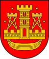 A coat of arms depicting a golden castle with three turrets surrounded with four golden stars all on a red background