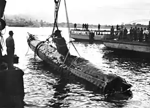 Image 37A Japanese Ko-hyoteki-class midget submarine, believed to be Midget No. 14, is raised from Sydney Harbour (from History of the Royal Australian Navy)