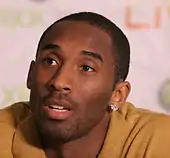 Head shot of Kobe Bryant in street clothes at a press conference