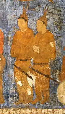 Korean (Goguryeo) ambassadors during an audience with king Varkhuman of Samarkand. They are identified by the two feathers on top of their head. 648-651 CE, Afrasiyab, Samarkand.