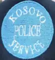 Former cap badge of the Kosovo Police Service