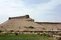 The fort sits atop a natural mound.