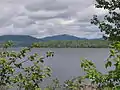 Lac Aux Araignées, public access point route 161. Mount Flat Top (830 meters) on the left; and Merrill (997 meters) in the center, background.