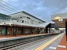 Platform shelter and concrete retaining wall viewed from the platform