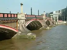 Lambeth Bridge, built by the LCC in 1932, its red colour being that of the nearby House of Lords