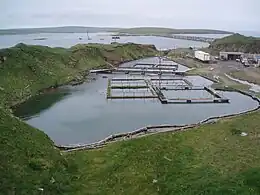 The flooded quarry on Lamb Holm, used for the Churchill Barriers. In the background is barrier no.2.