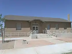 The Laveen School Auditorium was built in 1925 and is located at 5001 W. Dobbins Road. The building was listed in the National Register of Historic Places on August 30, 2011, reference #88001601.