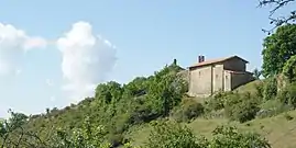 The chapel of Our Lady, with the ruins of the castle in the background