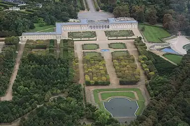 The Grand Trianon with courtyard and gardens. The wing at left is a residence of the President of France.