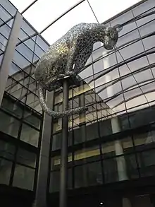 large metal cat on top of pole