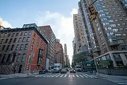 Mid 19th century brownstones and 20th century high rises along Lexington Avenue