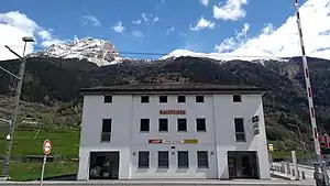 Three-story stone building with hip roof