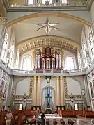 Altar with a large crucifix in the western side wing