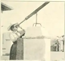 Lilian Martin-Leake at her telescope on the roof of the Hotel de la Régence, Algiers.