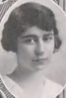 A young white woman with bobbed dark hair, in an oval frame