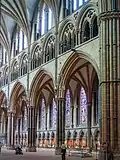 Pointed arches in the arcades, triforium, and clerestory of Lincoln Cathedral (1185–1311)