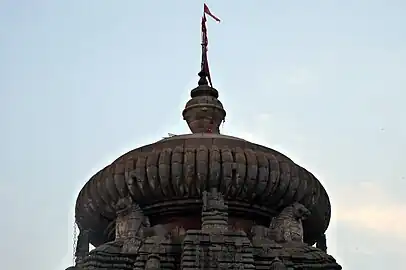 sculpture of lion projecting from the main spire of the temple