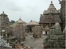 Image of a conical temple tower with smaller shrines around it.