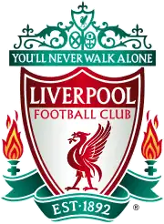 The words "Liverpool Football Club" are in the centre of a pennant, with flames either side. The words "You'll Never Walk Alone" adorn the top of the emblem in a green design, "EST 1892" is at the bottom