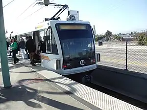 A westbound train at Long Beach Boulevard station