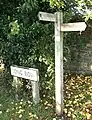 Section 61 – One of a number of signposts in the village showing the direction of the path