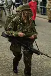 A British soldier wearing No. 8: trousers, parka and bush hat.